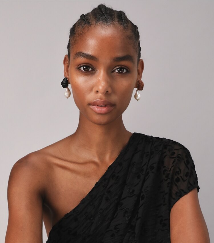 Tory Burch designer bracelets Leather Knot Pearl Drop Earring in Tory Gold / Ivory Pearl / Black / Cuoio accessory on model