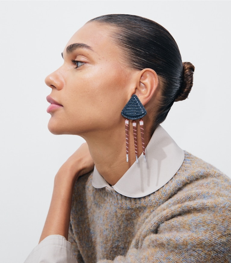 Tory Burch designer earrings Leather Tiger Earrings in Aged Silver / Navy accessory on model