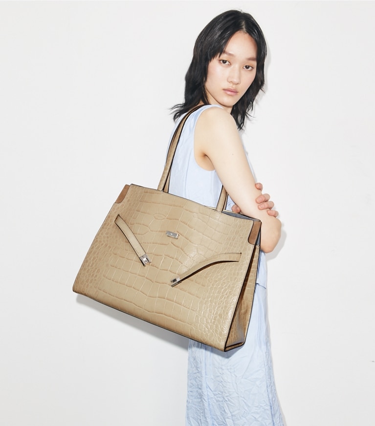 Tory Burch designer tote bags Lee Radziwill Embossed Tote in Light Hickory accessory on model