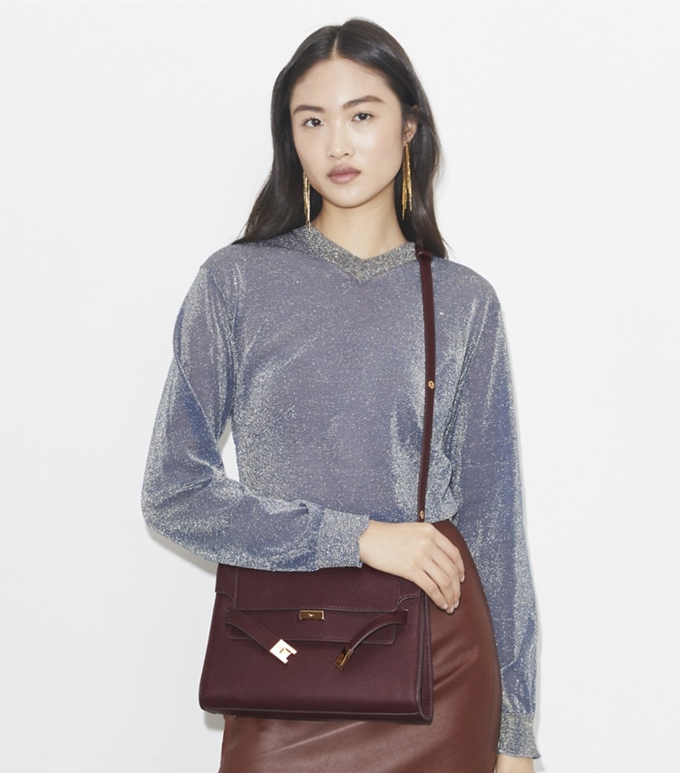 Tory Burch designer shoulder bags Lee Radziwill Pebbled Shoulder Bag in Dark Carmine additional on model