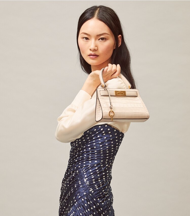 Tory Burch designer crossbody bags Lee Radziwill Petite Bag in Clay accessory on model