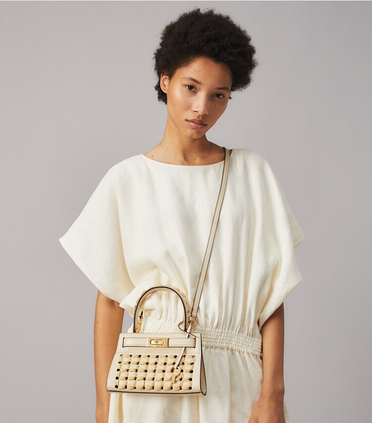 Tory Burch designer crossbody bags Lee Radziwill Petite Bag in New Cream accessory on model
