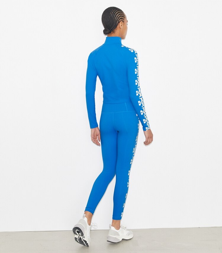 Tory Burch designer pantaloni Leggings Compression 7/8 con logo in Bay Blue on model back