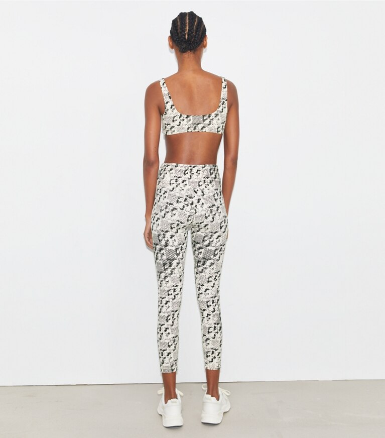 Tory Sport designer pantaloni Leggings leggeri stampati 7/8 a vita alta in New Ivory Distressed Pixelated Logo front