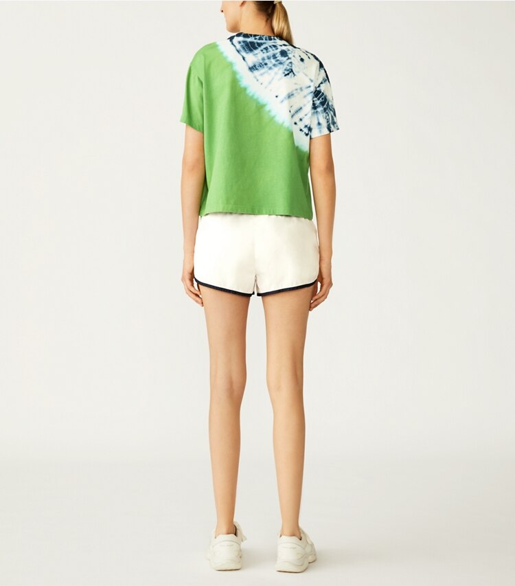 Tory Sport designer bottoms Lightweight Nylon Track Short in Snow White on model back