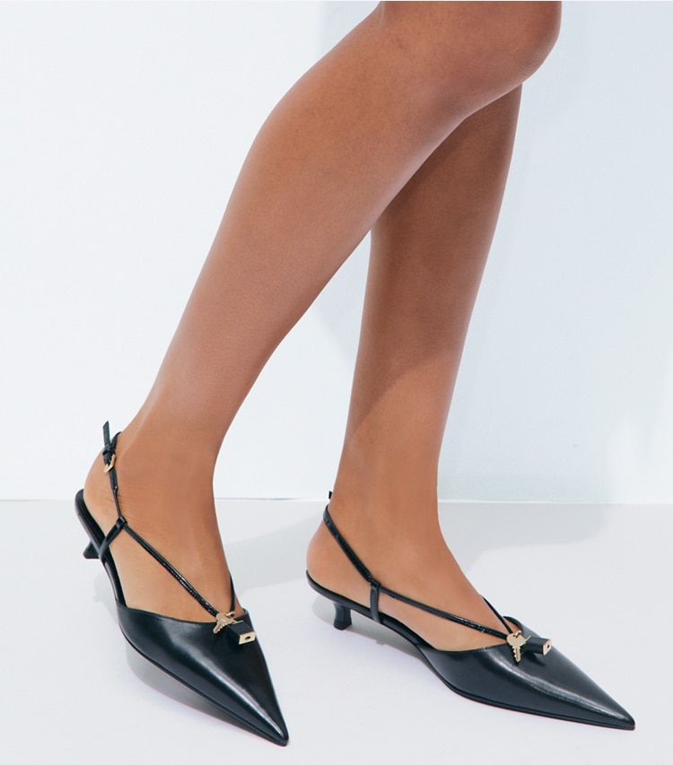 Tory Burch designer heels Lock Low Heel Pump in PERFECT BLACK / GOLD accessory on model