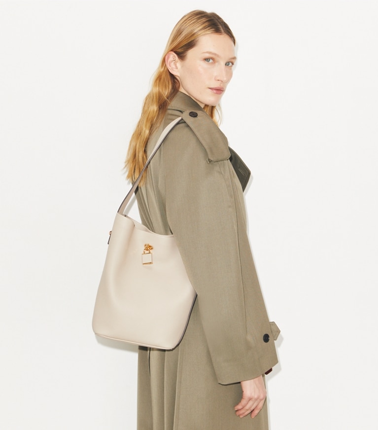 Tory Burch designer shoulder bags Lock Slim Bucket Bag in Light Stone accessory on model