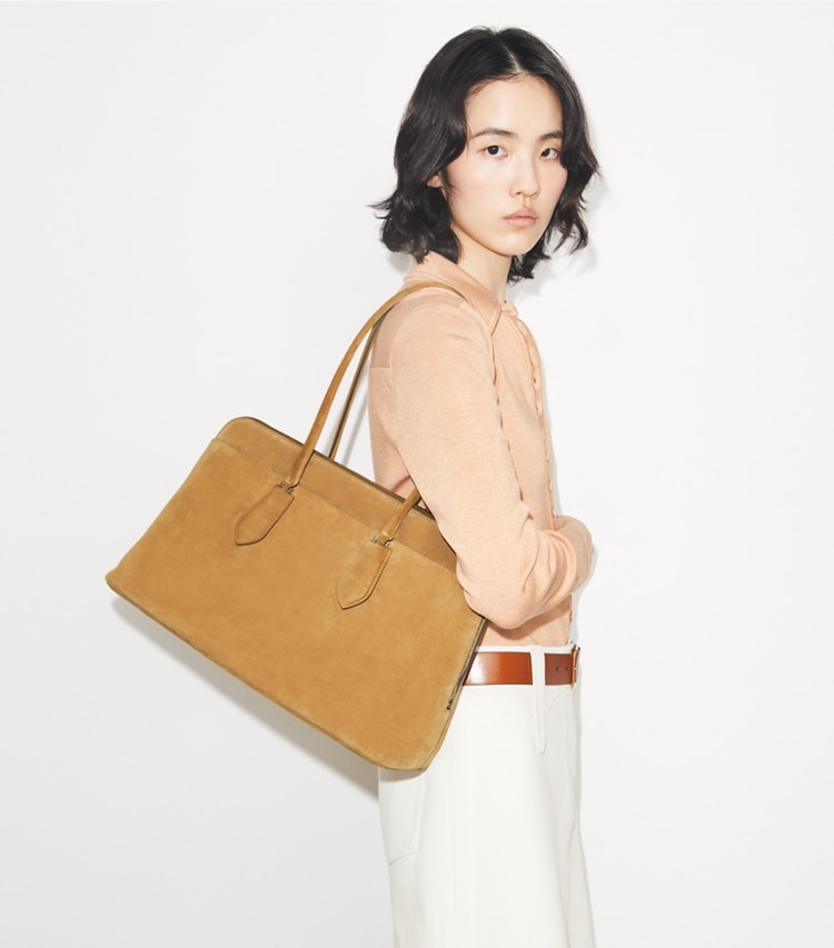 Tory Burch designer satchels Lock Suede Satchel in Toffee accessory on model