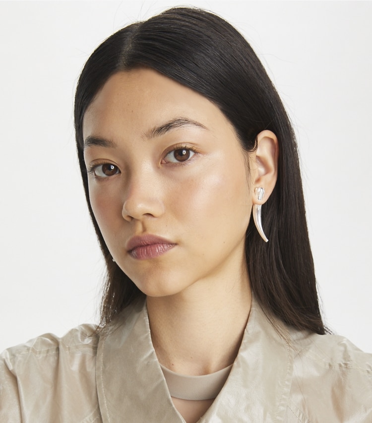 Tory Burch designer earrings Logo Spike Front-Back Earrings in Light Brass accessory on model