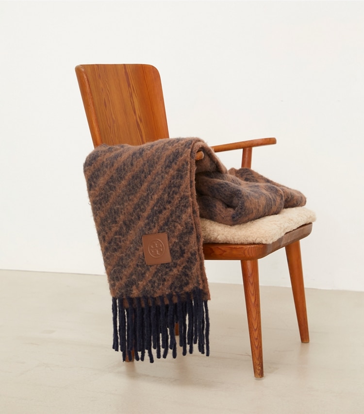 Tory Burch designer décor Logo Stripe Bouclé Blanket in NAVY / BROWN editorial