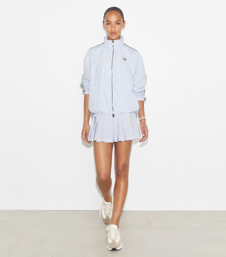 Tory Burch designer jackets Logo Tape Jacket in Light Blue on model front