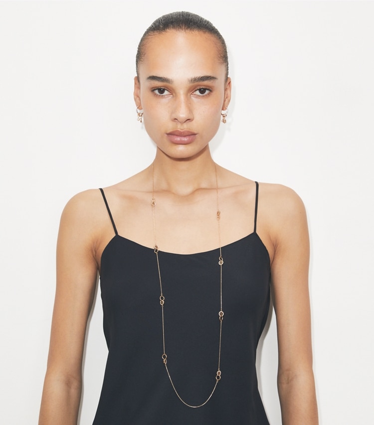 Tory Burch designer necklaces Long Icon Pavé Interlocking Necklace in Tory Gold / Crystal accessory on model