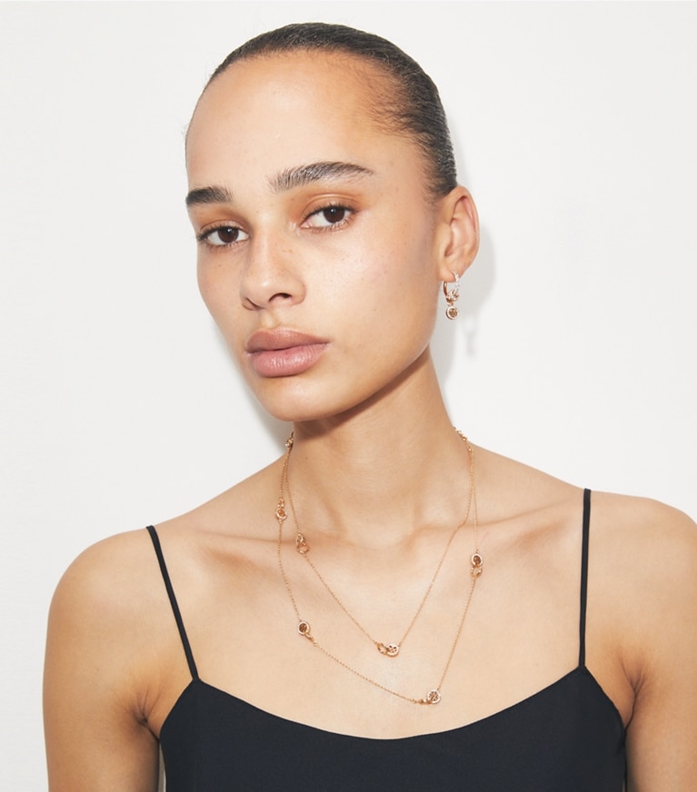 Tory Burch designer necklaces Long Icon Pavé Interlocking Necklace in Tory Gold / Crystal additional on model
