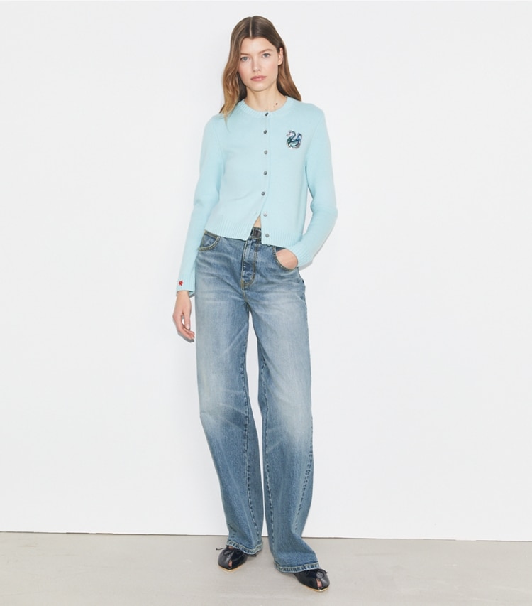 Tory Sport designer sweaters Lucky Duck Merino Wool Cardigan in Pastel Sky on model front