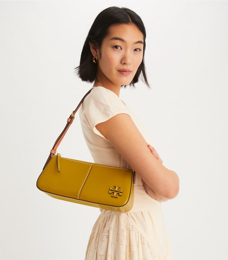 Tory Burch designer shoulder bags McGraw Spazzolato Wedge in ISLAND PALM accessory on model