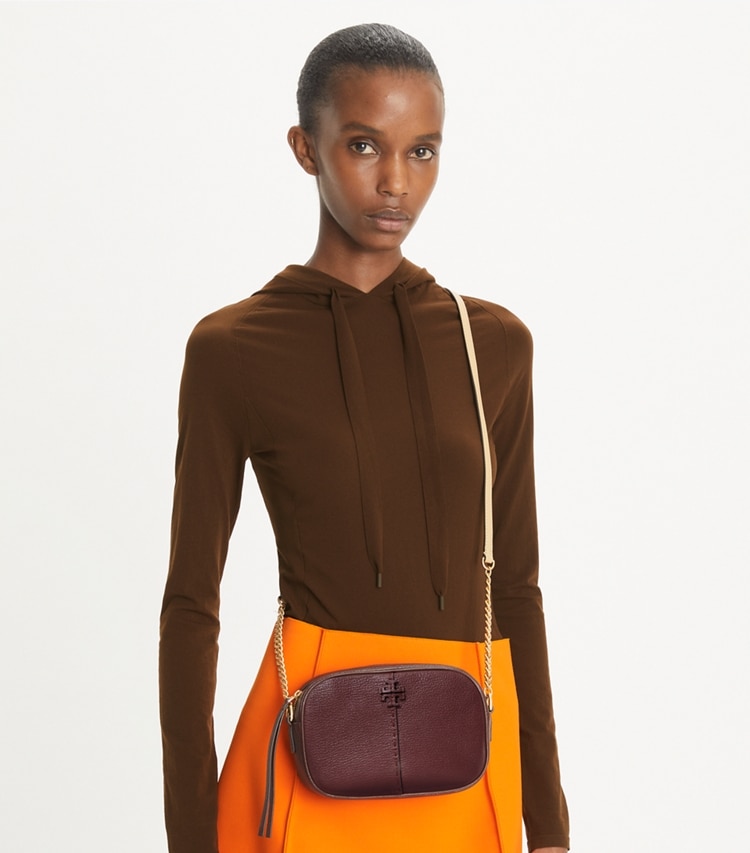 Tory Burch designer crossbody bags McGraw Textured Leather Camera Bag in Muscadine accessory on model