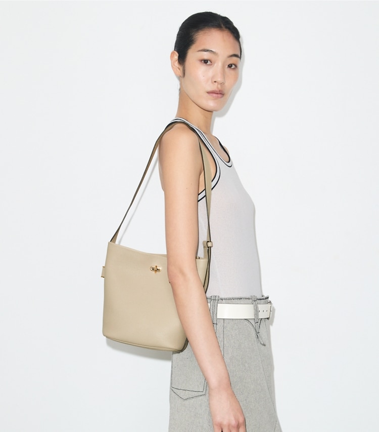 Tory Burch designer shoulder bags Medium Lock Slim Bucket Bag in Light Stone additional on model