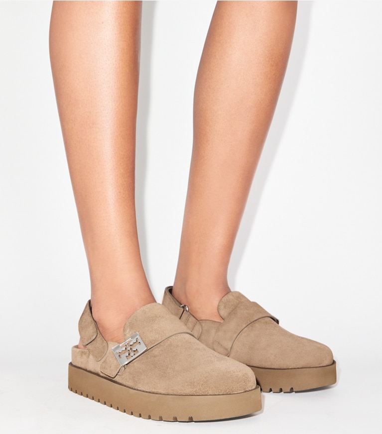Tory Burch designer flats Mellow Sport Mule in RIVER ROCK / SILVER accessory on model