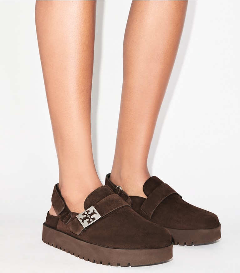 Tory Burch designer flats Mellow Sport Mule in DARK COCOA / SILVER accessory on model