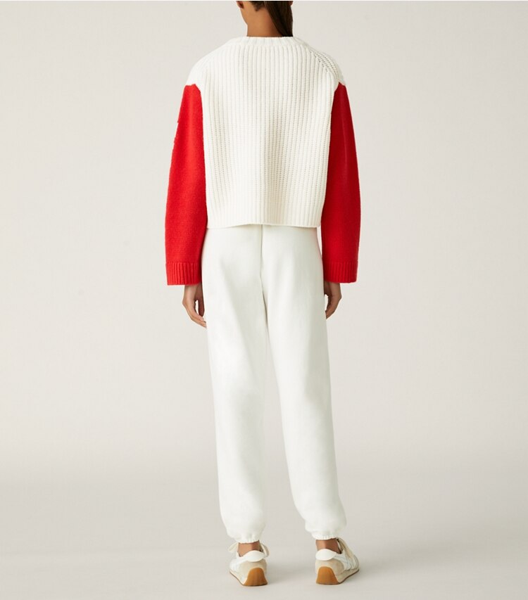 Tory Sport designer sweaters Merino Aprés Ski Sweater in Snow White / Red on model back