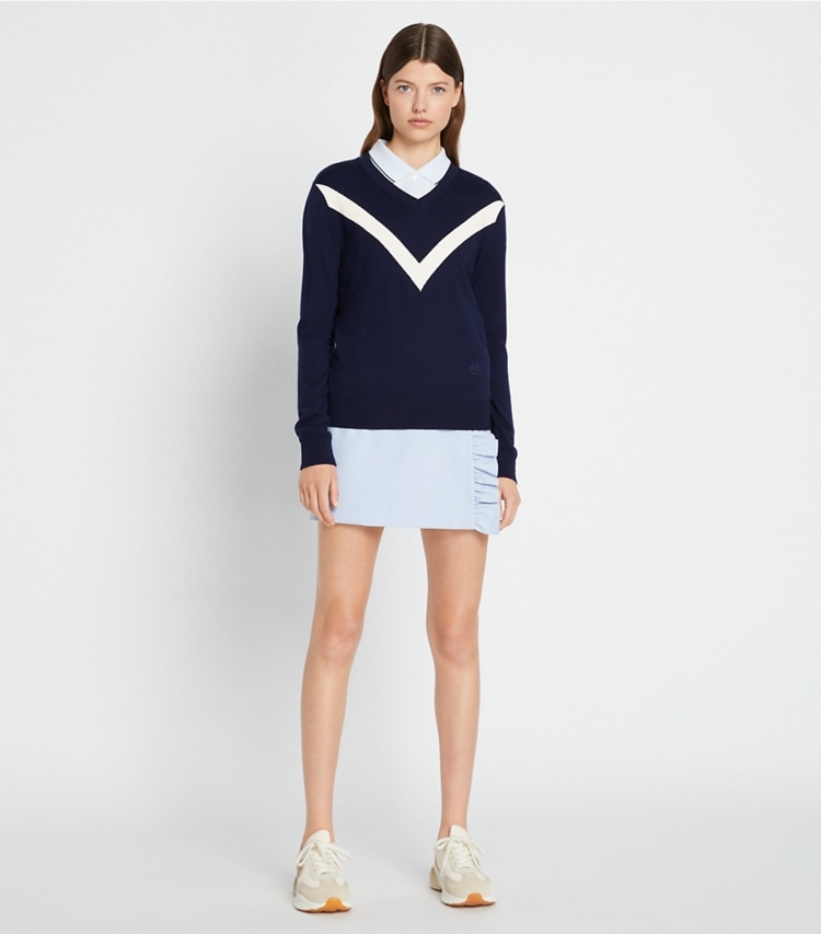 Tory Sport designer sweaters Merino Chevron Sweater in Tory Navy / New Ivory on model front
