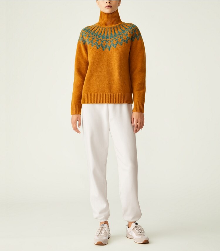 Tory Sport designer sweaters Merino Fair Isle Sweater in Orange Rust Mountain Fair Isle on model front