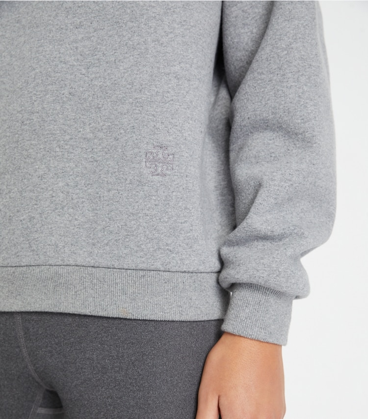 Tory Sport designer sweaters Merino French Terry Raglan Crewneck in Medium Gray Heather on model detail