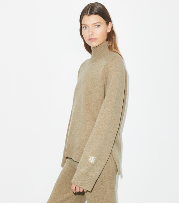 Tory Burch designer sweaters Merino Wool Turtleneck Sweater in Oatmeal Melange on model detail