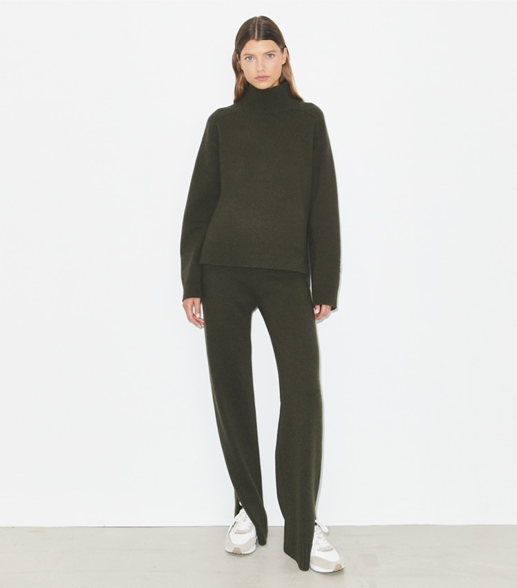 Tory Burch designer sweaters Merino Wool Turtleneck Sweater in Loden on model front