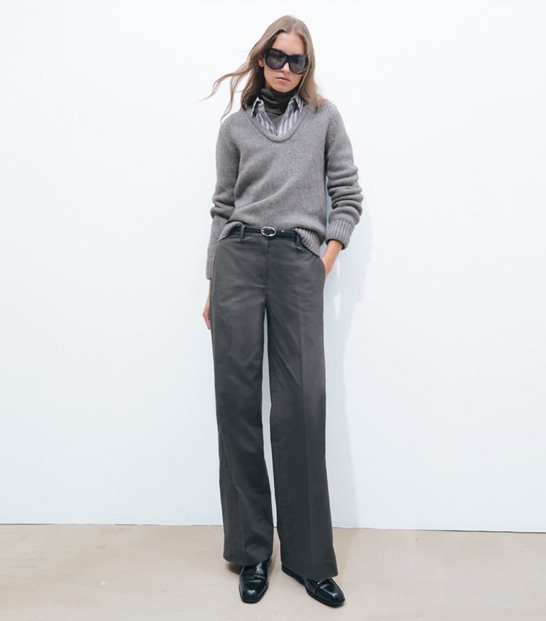 Tory Burch designer sweaters Merino Wool U-Neck Sweater in Cloudy Gray Melange on model front