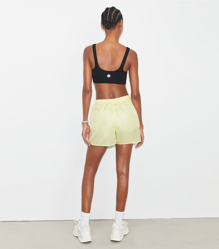 Tory Sport designer bottoms Mesh-Panel Nylon Short in Lumen on model back