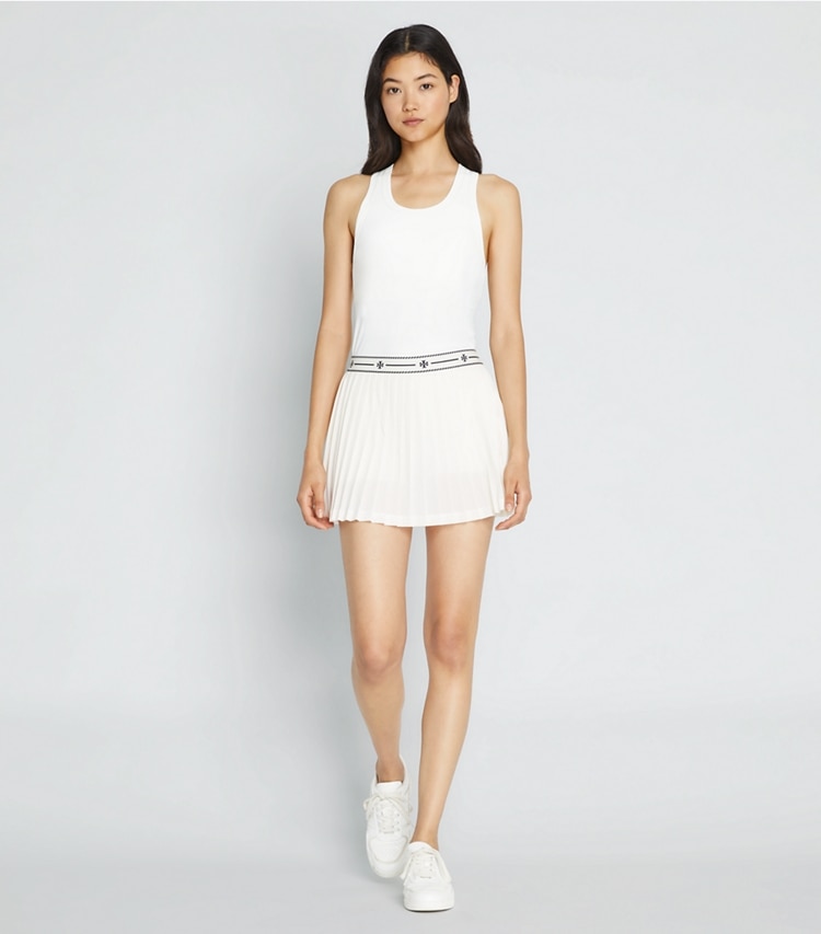 Tory Sport designer bottoms Mesh Tennis Skirt in Snow White on model front
