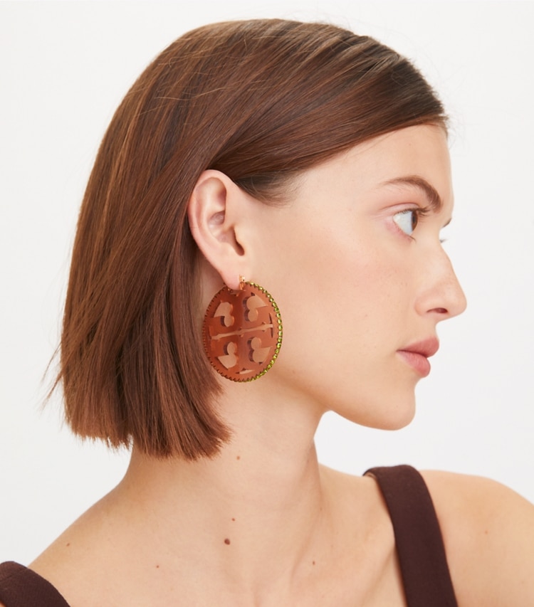 Tory Burch designer earrings Miller Crystal Resin Hoop Earring in Tory Silver / Transparent Blue accessory on model
