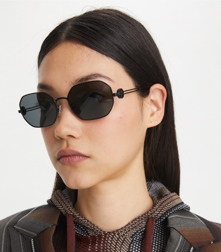 Tory Burch designer sunglasses & eyewear Miller Metal Oval Sunglasses in SHINY BLACK/DARK GREY accessory on model