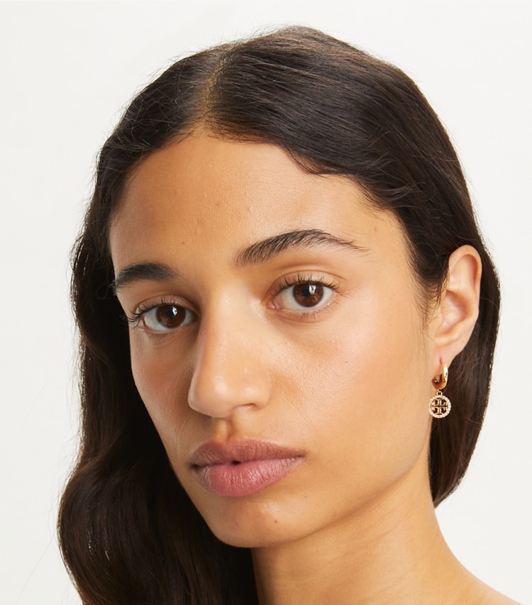 Tory Burch designer earrings Miller Pavé Huggie Hoop Earring in Tory Gold / Rose accessory on model