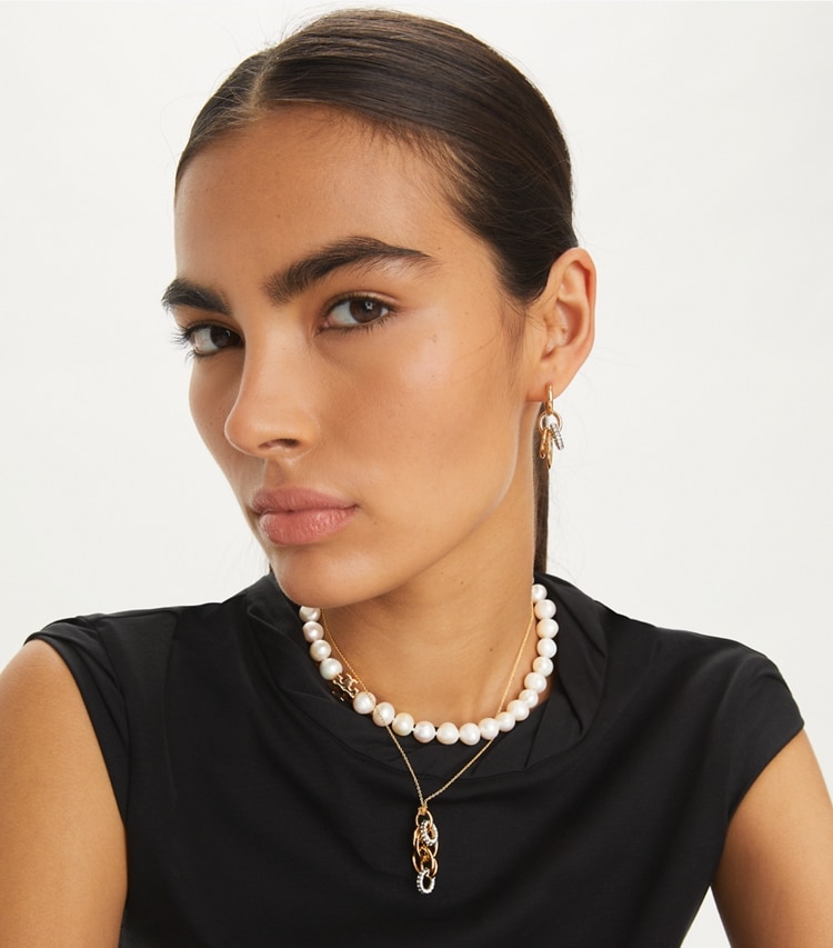 Tory Burch designer earrings Miller Pavé Interlocking Earring in Tory Gold / Crystal accessory on model