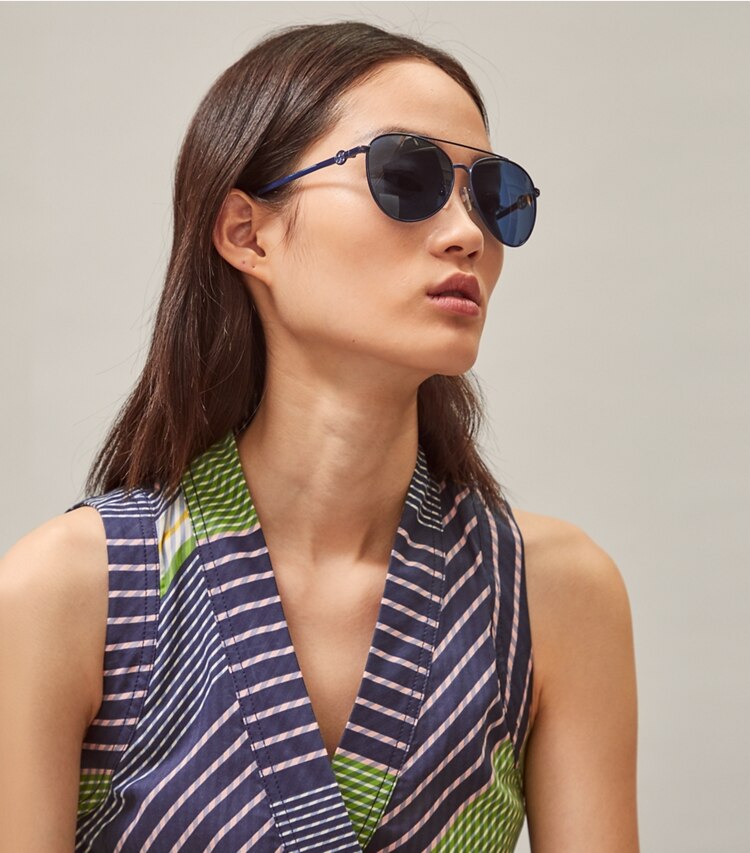 Tory Burch designer sunglasses & eyewear Miller Pilot Sunglasses in Shiny Gold Metal accessory on model
