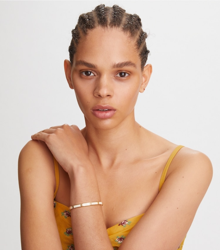 Tory Burch designer bracelets Miller Stud 5mm Enamel Hinge Bracelet in Tory Gold / Mint Swirl accessory on model