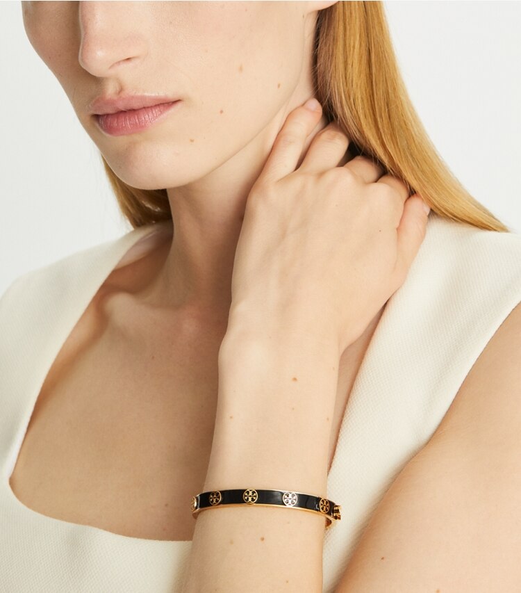 Tory Burch designer bracelets Miller Stud Enamel Hinged Bracelet in Tory Gold / New Ivory accessory on model