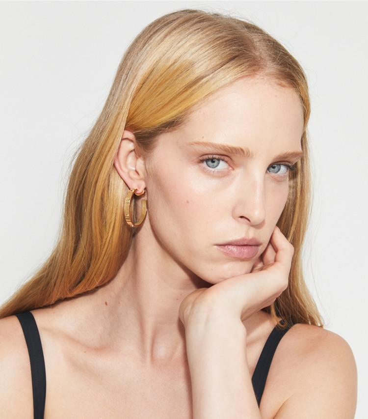 Tory Burch designer earrings Miller Stud Hoop Earring in Tory Gold accessory on model