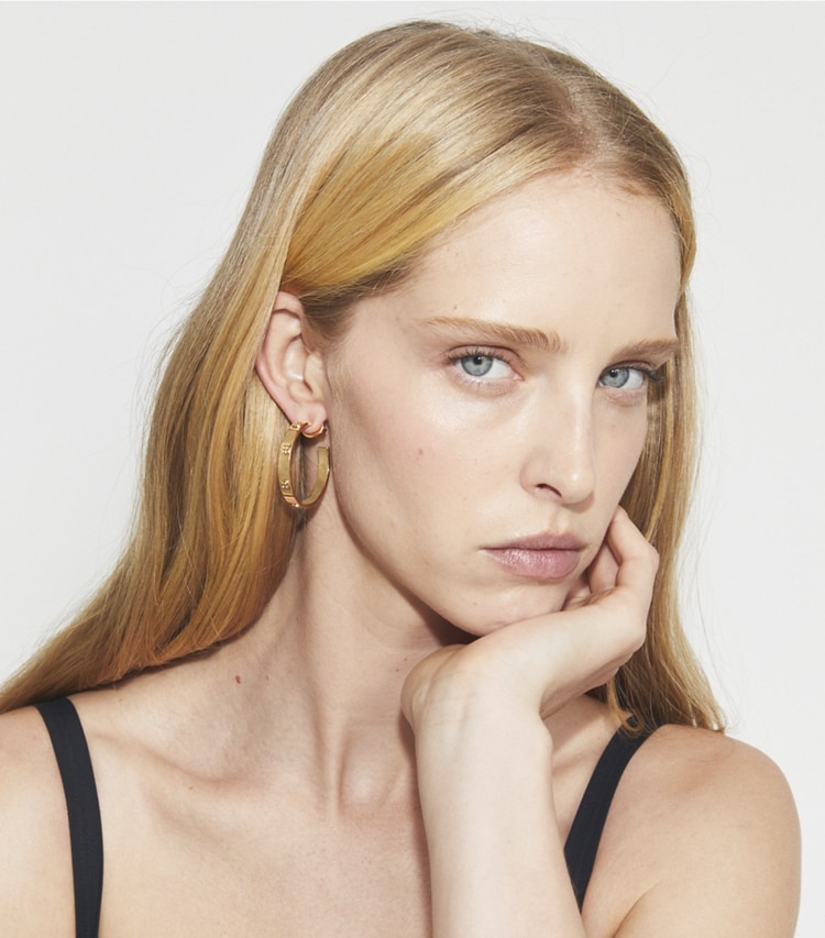Tory Burch designer earrings Miller Stud Hoop Earrings in Tory Gold accessory on model