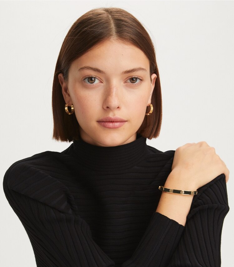 Tory Burch designer bracelets Miller Stud Leather Hinge Bracelet in Tory Gold / Green accessory on model