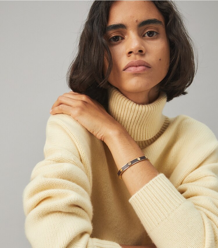 Tory Burch designer bracelets Miller Stud Leather Hinge Bracelet in Tory Gold / Pine Tree accessory on model