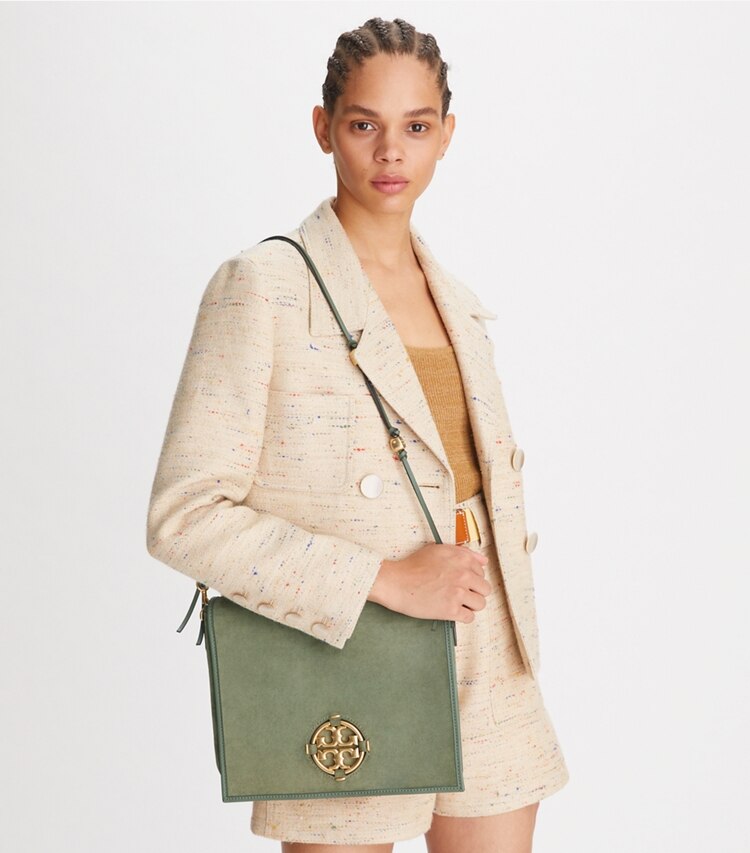 Tory Burch designer crossbody bags Miller Suede Messenger in PALM LEAF accessory on model