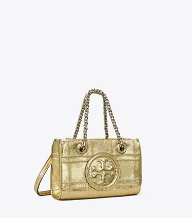 Tory Burch designer sacs à bandoulière Mini cabas Fleming en cuir souple à chaînette in 18 Kt Gold angle
