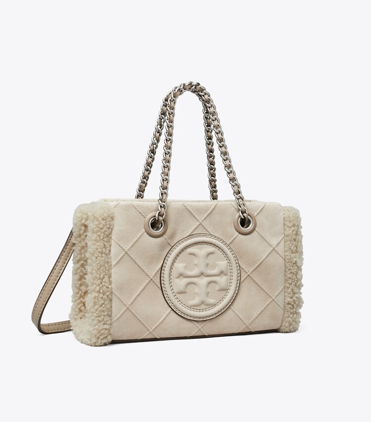 Tory Burch designer sacs à bandoulière Mini cabas Fleming en daim et shearling à chaînette in Cotton Grey angle