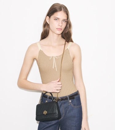 Tory Burch designer crossbody bags Mini Charlie Quilted Top-Handle Crossbody in Black accessory on model