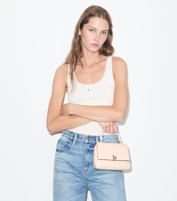 Tory Burch designer crossbody bags Mini Charlie Quilted Top-Handle Crossbody in Soft Pink accessory on model