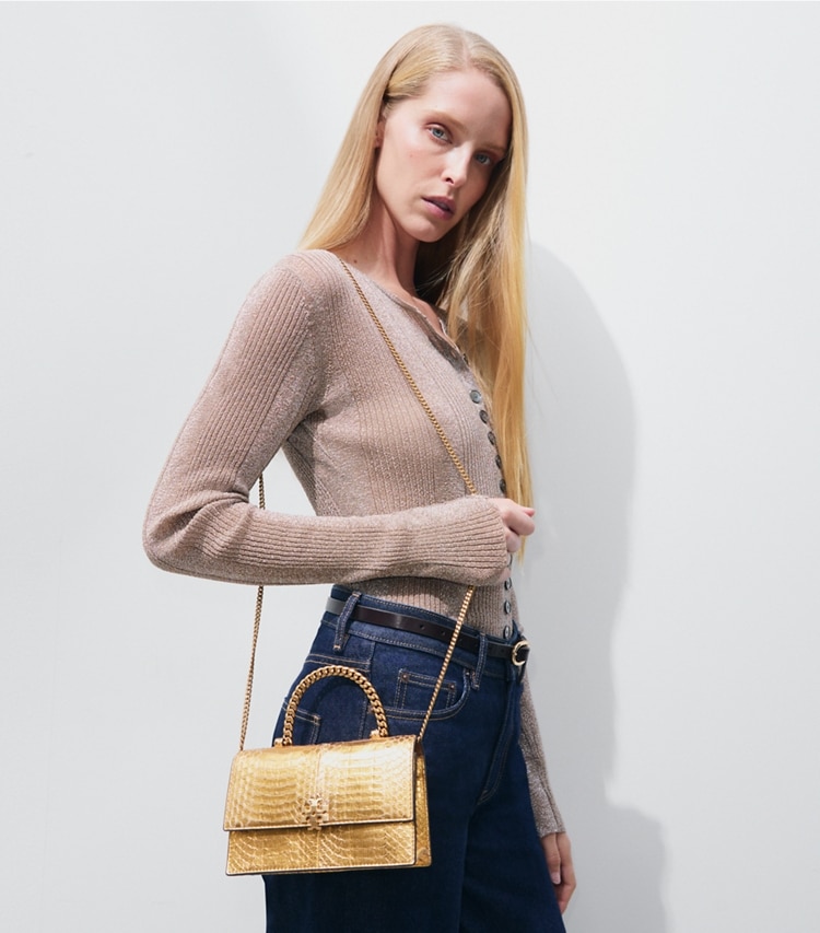 Tory Burch designer crossbody bags Mini Charlie Snake Top-Handle Crossbody in Gold accessory on model
