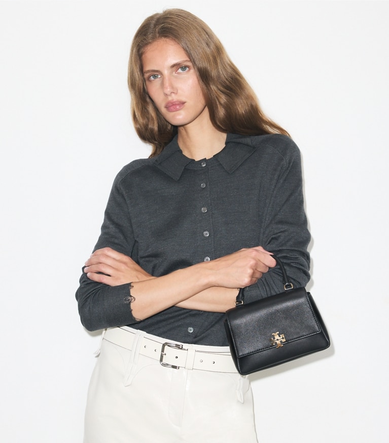 Tory Burch designer crossbody bags Mini Charlie Top-Handle Crossbody in Black accessory on model